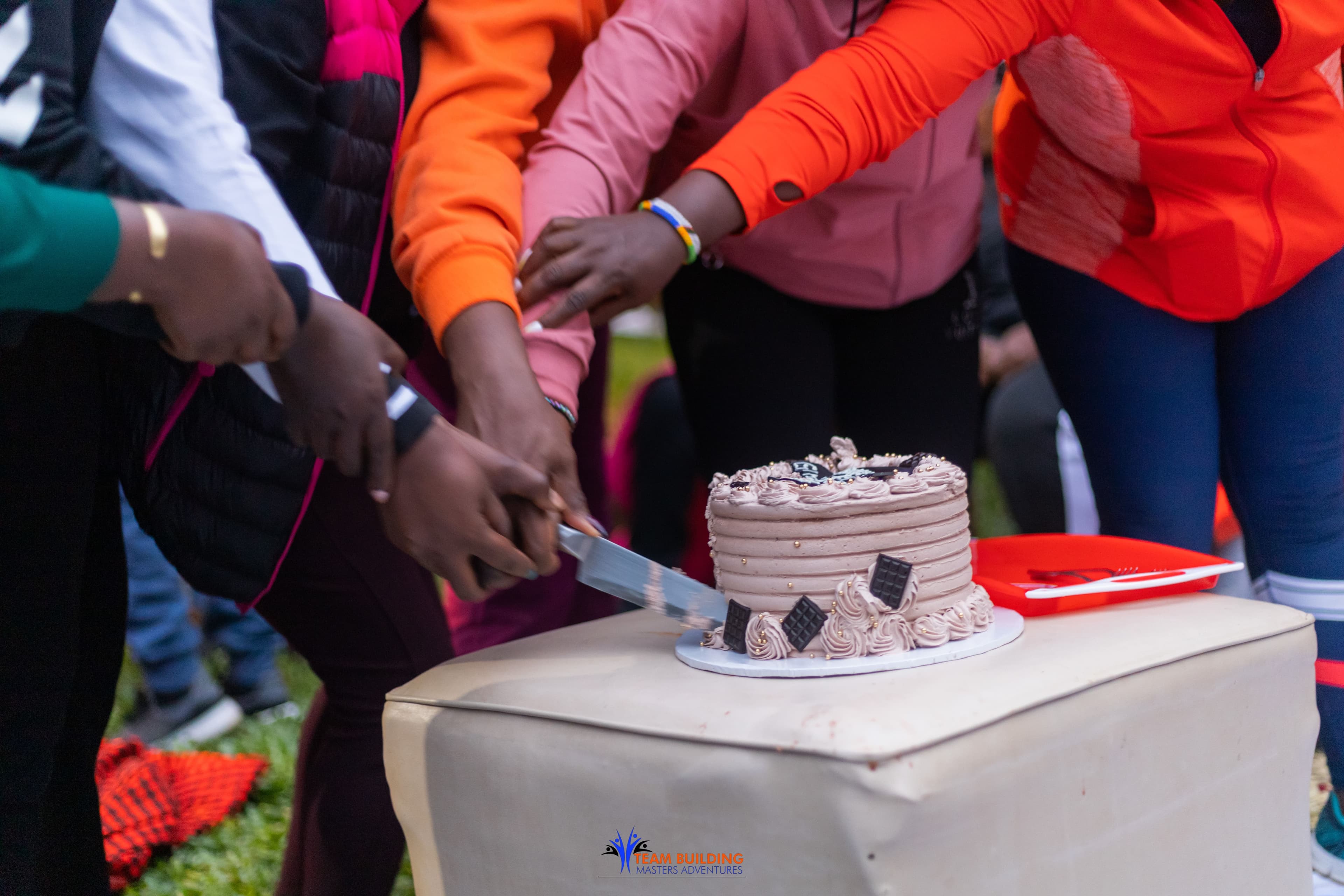 Birthday celebration with decorations and people outdoors